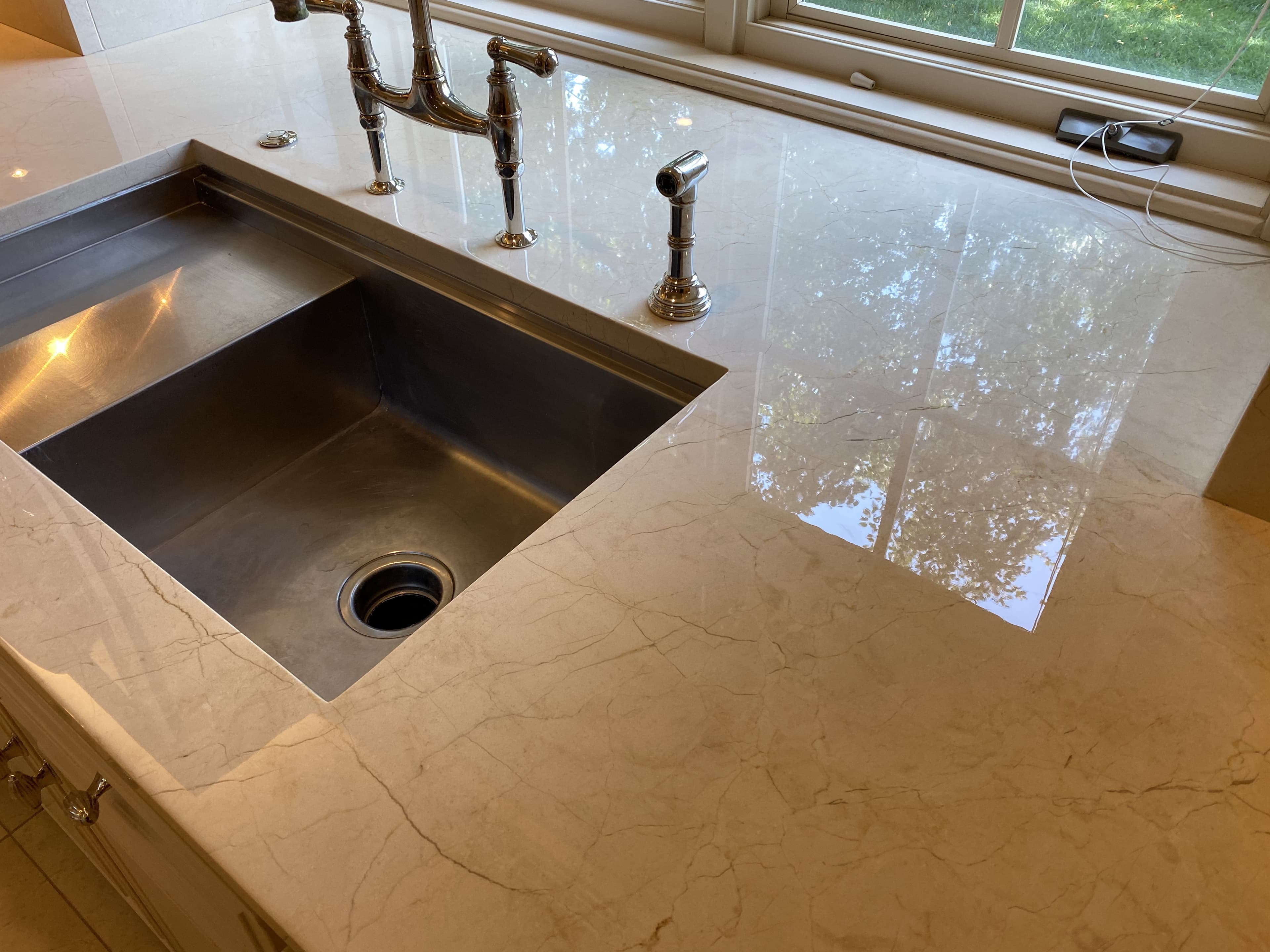 Polished marble counter at an undermount sink